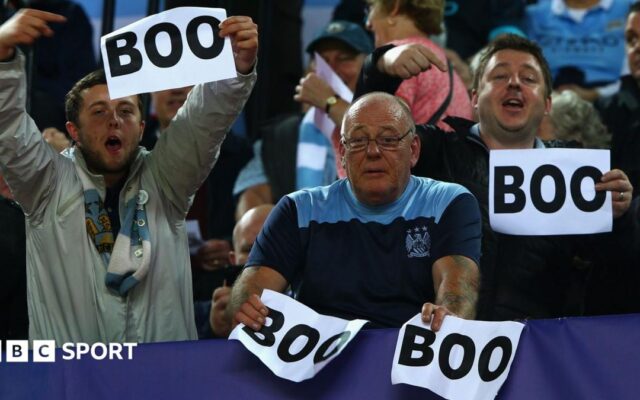 Why do Man City fans boo pre-match anthems?