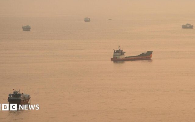 Container ship hit by projectile sinks in Strait of Hormuz, Singapore says